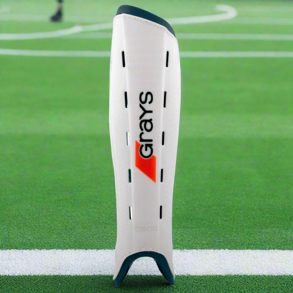 White shin guard with 'Grays' branding on a white background