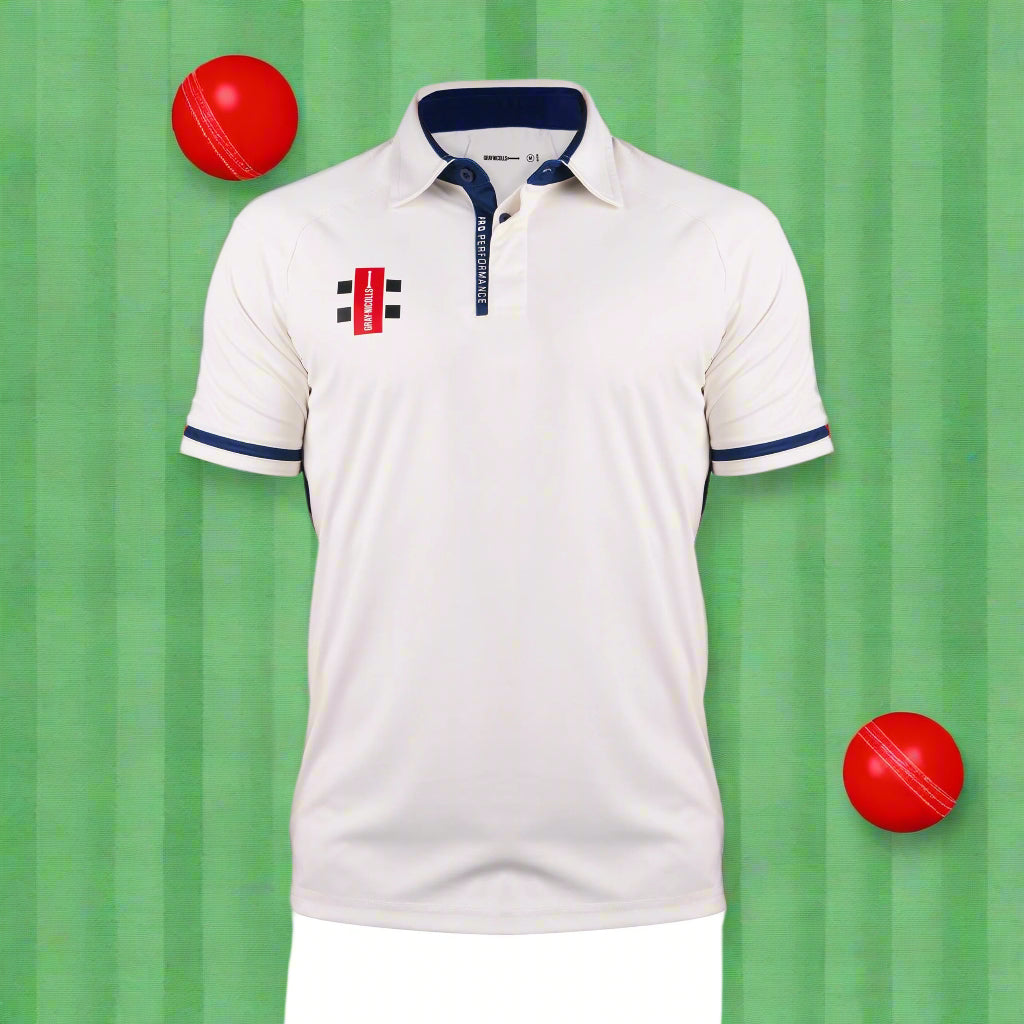A long sleeve sports uniform shirt in white with navy details, featuring a traditional British collar and a PRO Performance print on the extended placket.