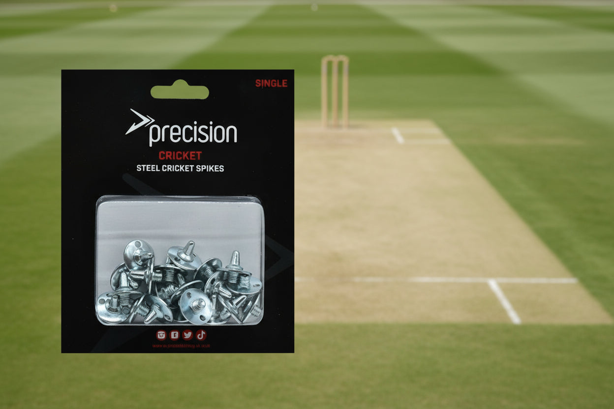 A package of individual steel cricket spikes by Precision Cricket, displayed in a clear plastic window.