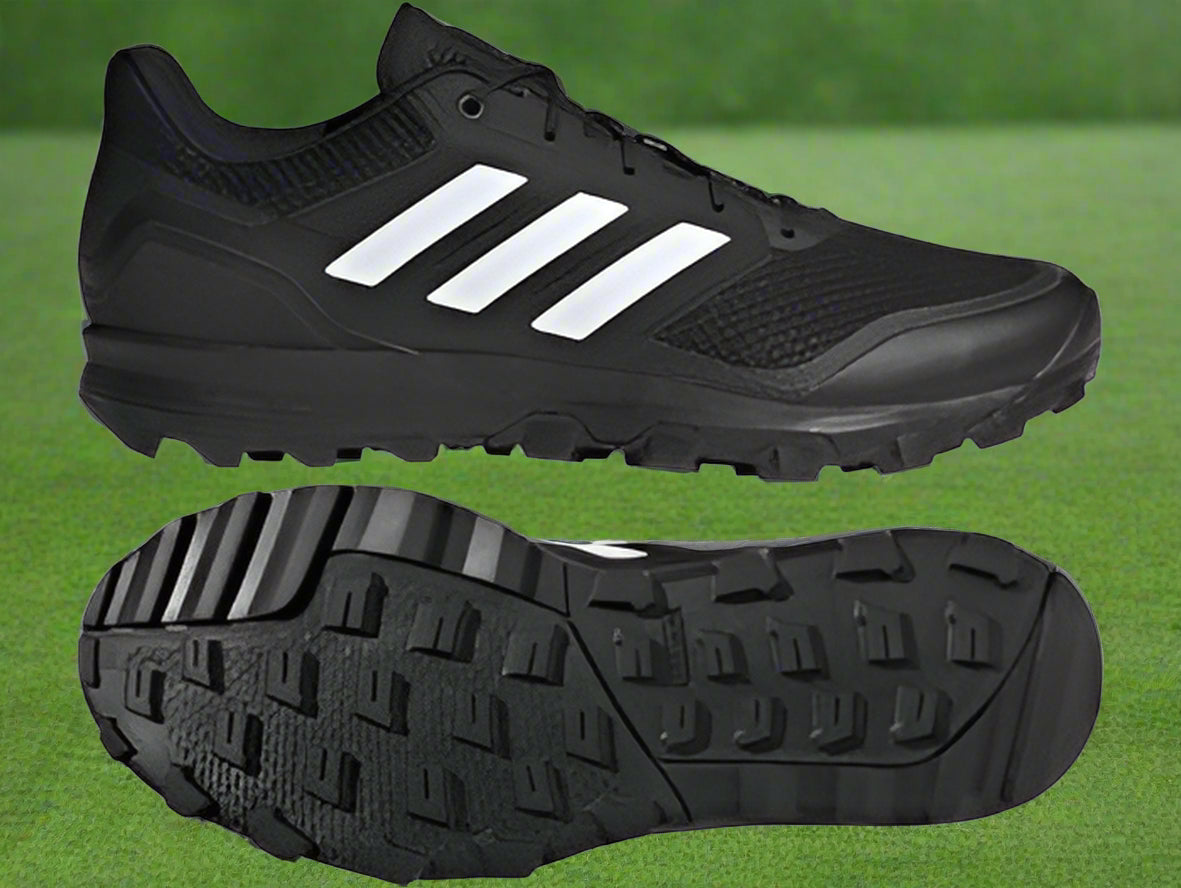 A pair of black adidas hockey shoes with white stripes, showcasing the mesh upper, cloudfoam cushioning midsole, and traction outsole.