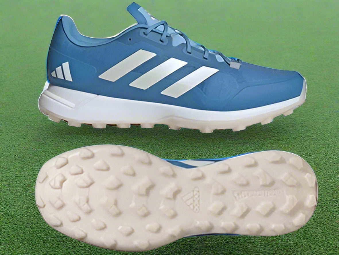 A pair of blue Zone Dox 2.2 hockey shoes with white accents and a Continental rubber outsole.