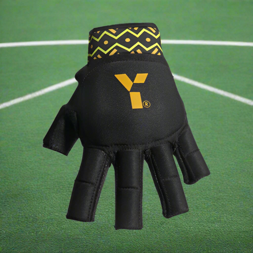 A black field hockey or lacrosse protective glove with a geometric pattern on the wrist and the Y1 logo on the back of the hand.