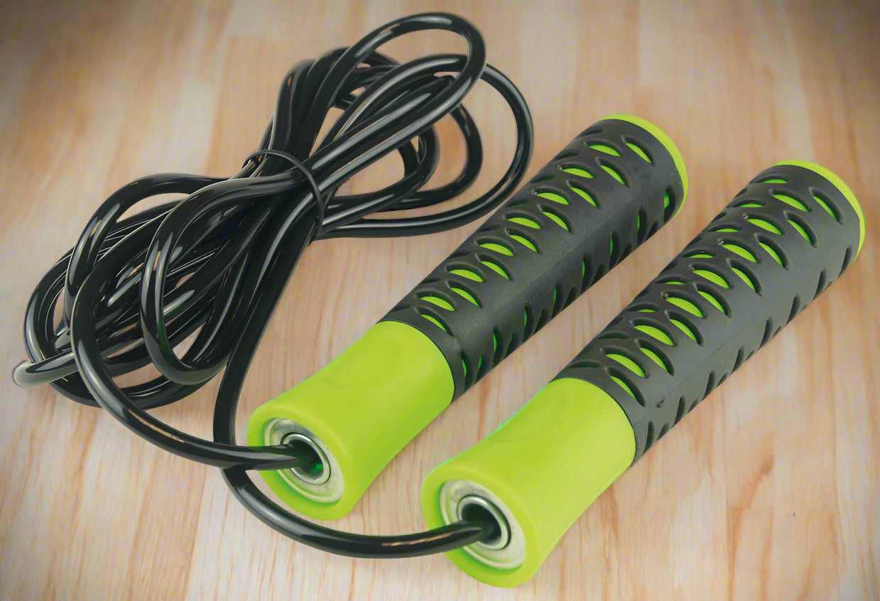 A black and green high grip speed skipping rope with foam handles and steel rope.