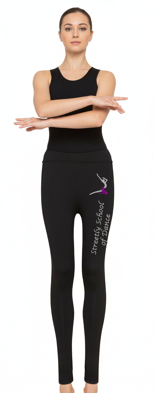 Person wearing a black outfit with a logo on leggings against a white background