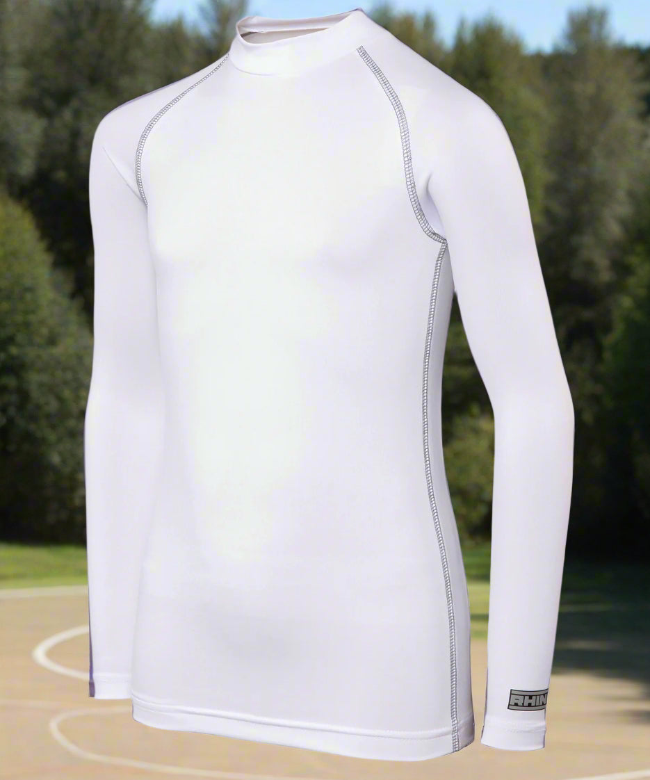 A long sleeve white baselayer for juniors, with a collar and made of a polyester and spandex blend.