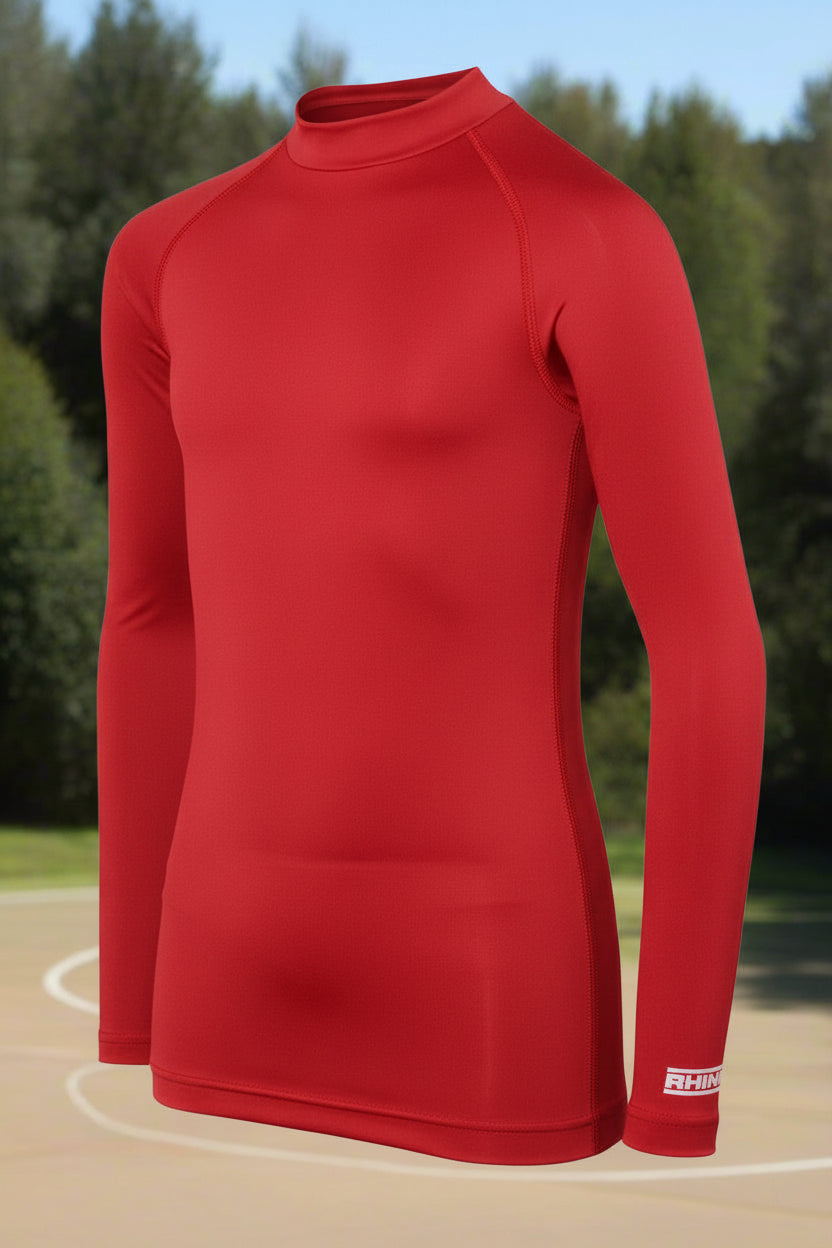 A long sleeve black baselayer for juniors, with a collar and made of a polyester and spandex blend.