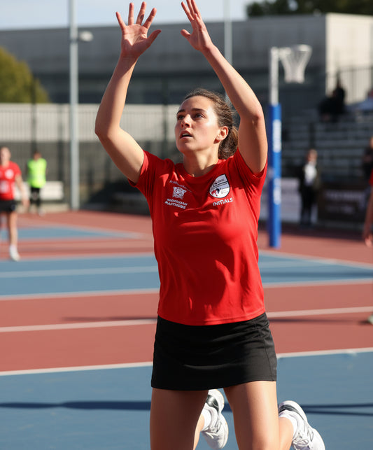 Red t-shirt with logos on a wooden background