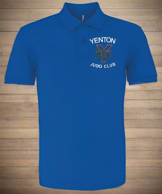 A blue polo shirt with 'YENTON JUDO CLUB' embroidered in green and yellow on the front. The shirt has a classic fit with a two-button placket, knitted collar, and cuffs.