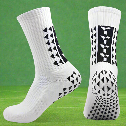 A pair of white anti-slip socks with black geometric patterns on the side, designed for sports use.