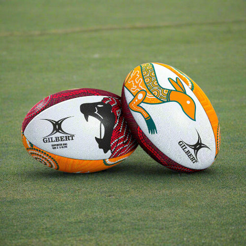 Two British and Irish rugby balls with colorful designs on a white background