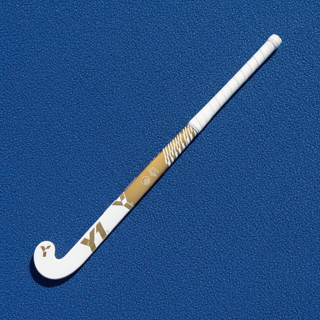 White and gold hockey stick on a white background