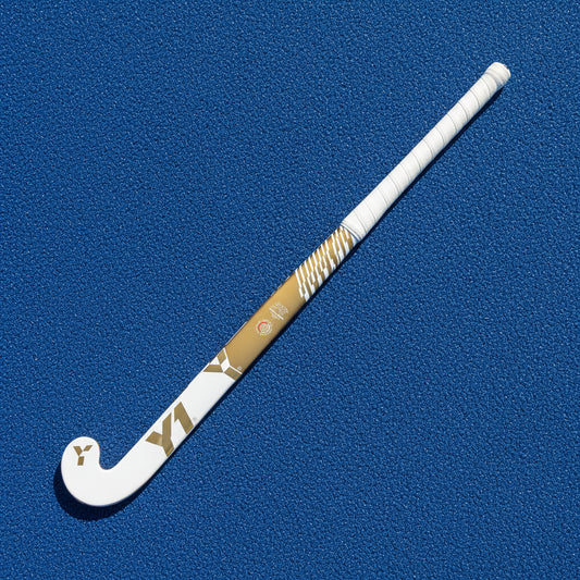 White and gold hockey stick on a white background