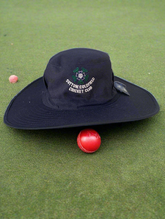 Navy blue cap with logo on a shelf in a store