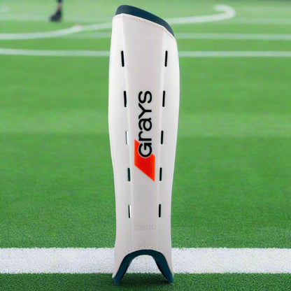 White shin guard with 'Grays' branding on a white background