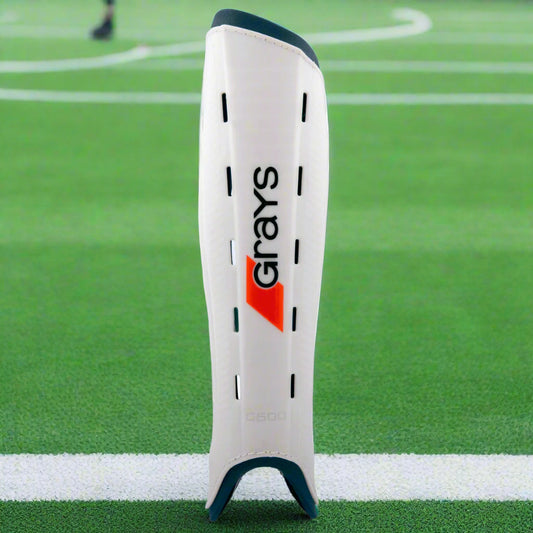 White shin guard with 'Grays' branding on a white background