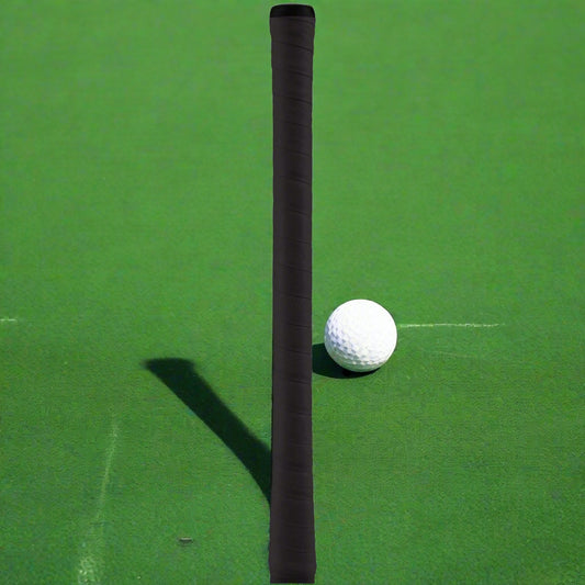 A black hockey stick grip with a hexagonal pattern for top hand control and a smooth lower section.