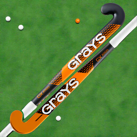 A pair of Grays Ultrabow field hockey sticks with orange, black, and white color scheme.