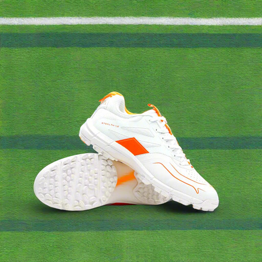 White sports shoes with orange accents on a light gray background