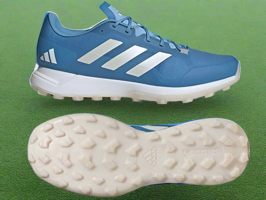 A pair of blue Zone Dox 2.2 hockey shoes with white accents and a Continental rubber outsole.