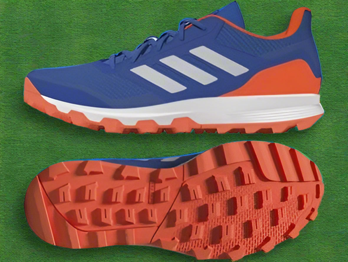 Blue and orange running shoes with white sole on a white background