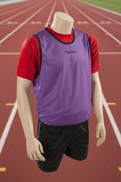 A mesh training bib in purple with black trim and a Precision logo on the chest area, displayed on a mannequin with black shorts.