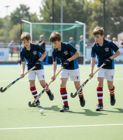 Collection of sports attire including socks, shorts, and a t-shirt on a green background.