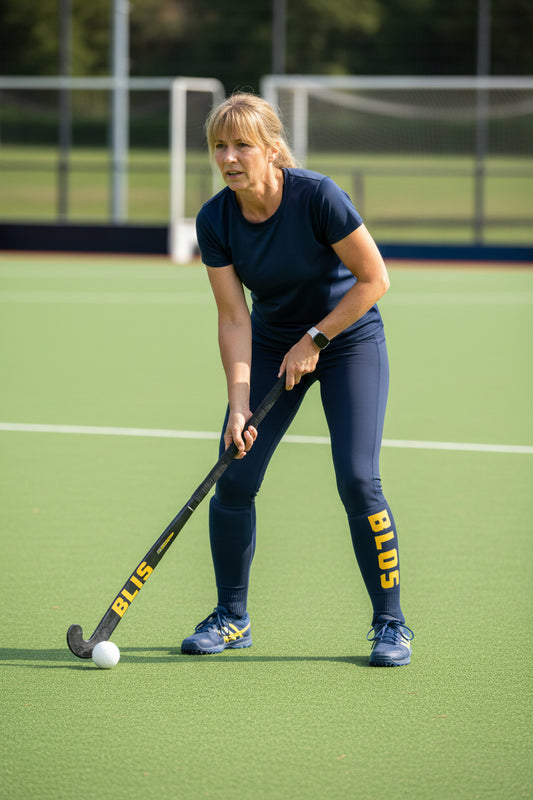 Navy leggings with yellow 'Bloss' branding on a white background