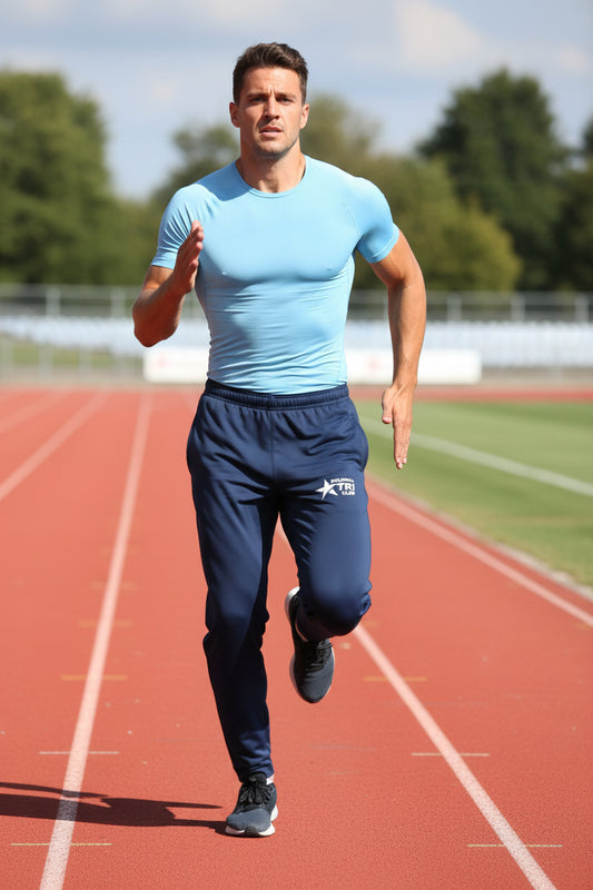 Navy blue sweatpants with a white logo on a white background